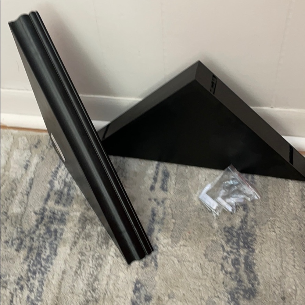 Two floating corner shelves